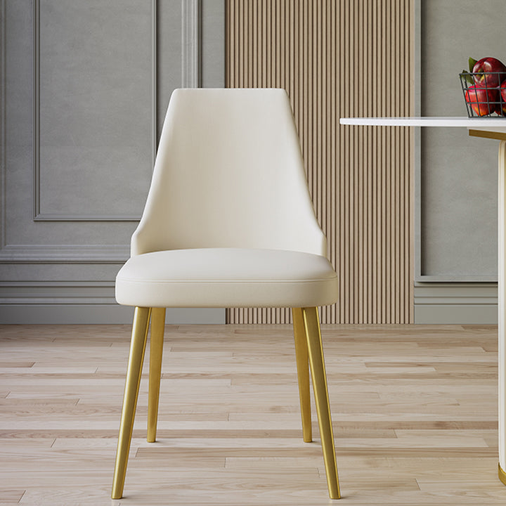 Minimalist cream-colored dining chair with wooden legs, ideal for modern interiors. Common questions include 'What type of dining chairs provide the best back support?' and 'How to choose dining chairs that match a light wood floor?