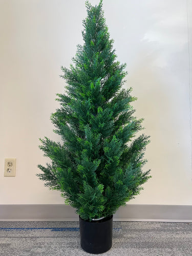 Artificial small evergreen tree in a black pot, featuring dense, lush green foliage, ideal for adding a touch of greenery to indoor spaces.