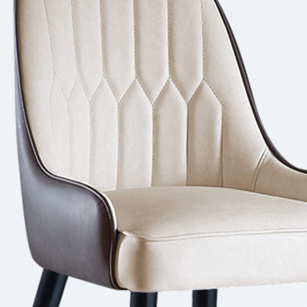 Close-up of a cream and brown PU leather dining chair featuring elegant stitching details. Common questions include 'How do you clean PU leather chairs?' and 'Is PU leather suitable for long-lasting furniture?