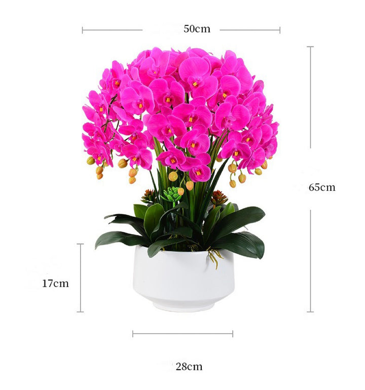 A vibrant artificial pink orchid arrangement in a white pot with measurements shown for height (65cm), width (50cm), and pot size (28cm x 17cm). How do I choose the right size of artificial flowers for home decor?