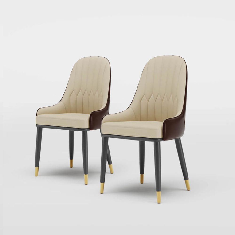 Set of two cream and brown PU leather dining chairs with black legs and gold accents, placed in a modern room. Common questions include 'Are PU leather chairs durable for everyday use?' and 'How do you maintain leather dining chairs?