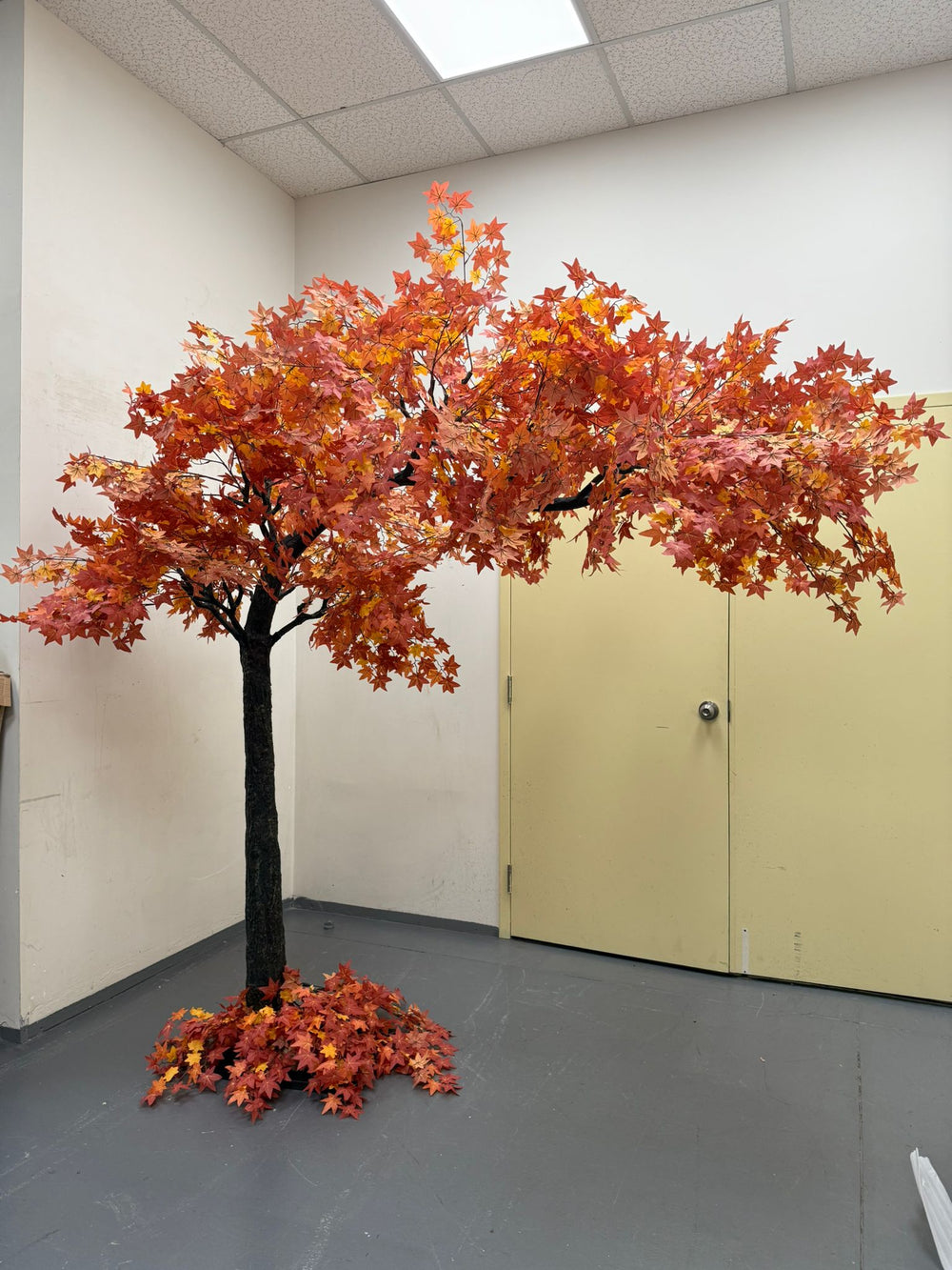 artificial arch maple tree rental set indoors for fall events.