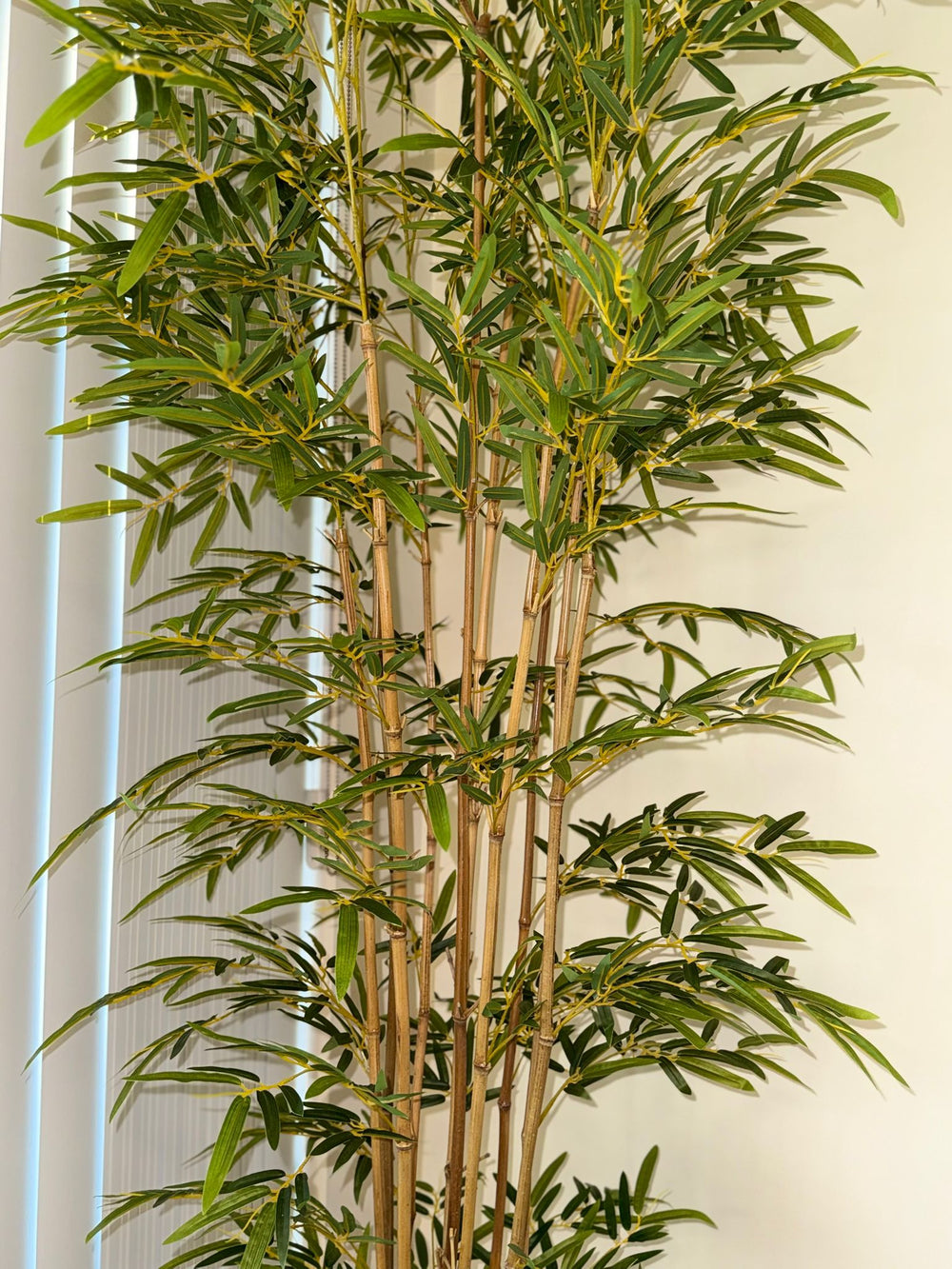 Close-up view of artificial bamboo leaves with fine texture and realistic color variation, designed to mimic the appearance of fresh natural bamboo foliage.