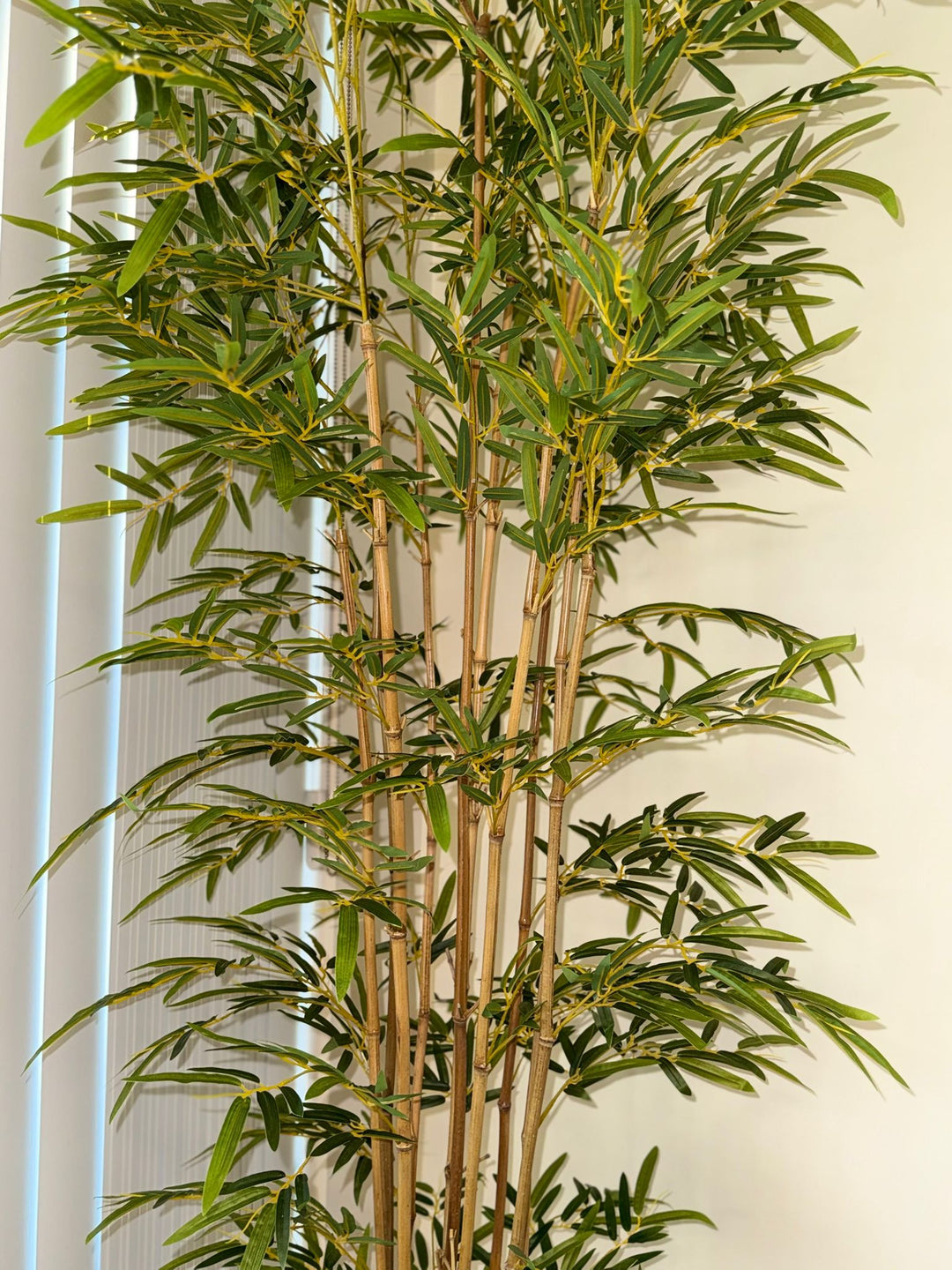 Close-up view of artificial bamboo leaves with fine texture and realistic color variation, designed to mimic the appearance of fresh natural bamboo foliage.