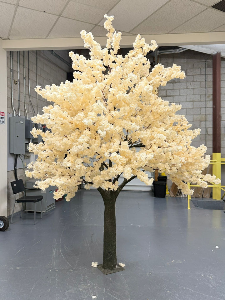 Artificial off white cherry blossom tree in a warehouse setting
