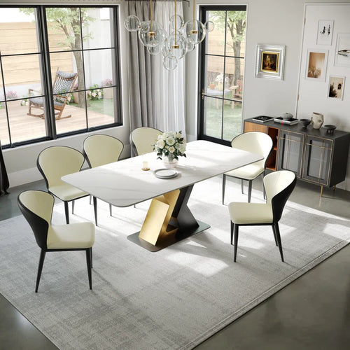 Modern dining table with a sleek white top and a unique gold and black geometric base, perfect for contemporary dining rooms and stylish home interiors.