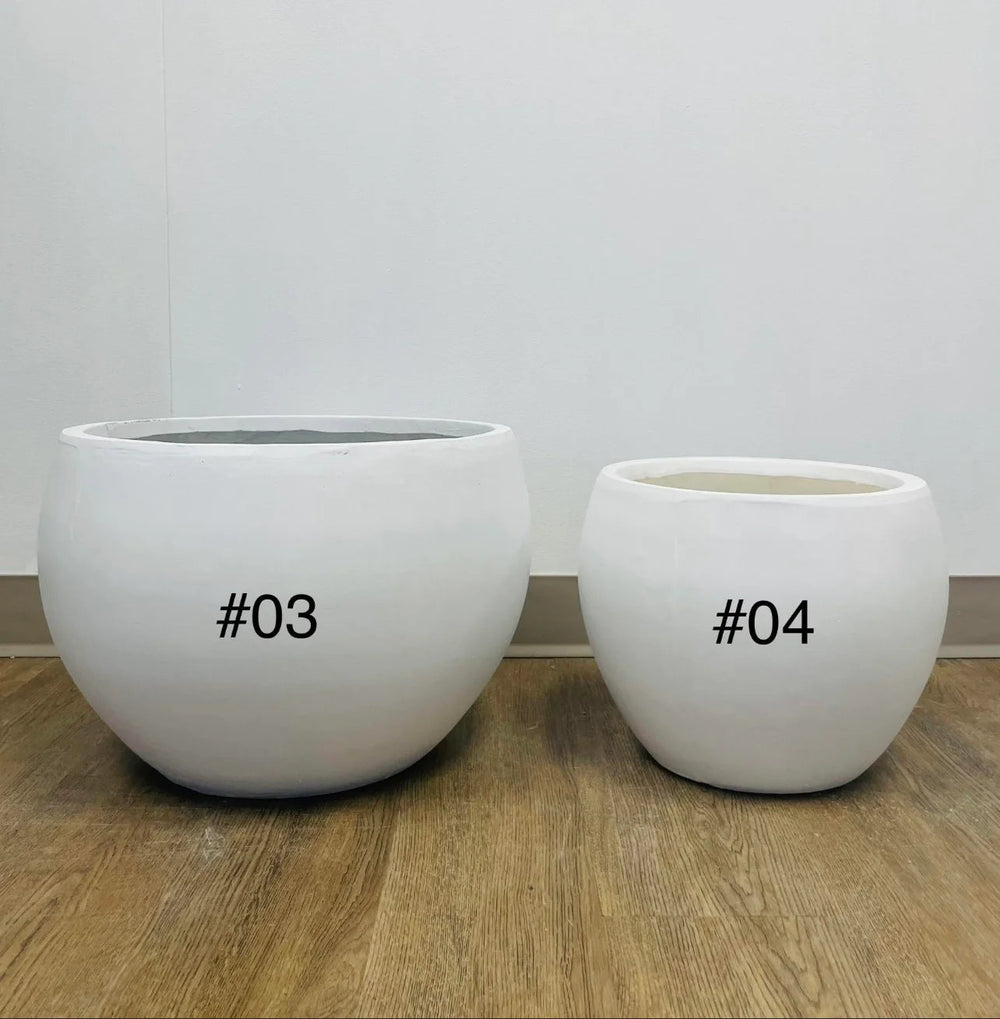 white cement round planters with a smooth finish, placed indoors on a carpeted floor near a window. What are the dimensions and weight of these planters?