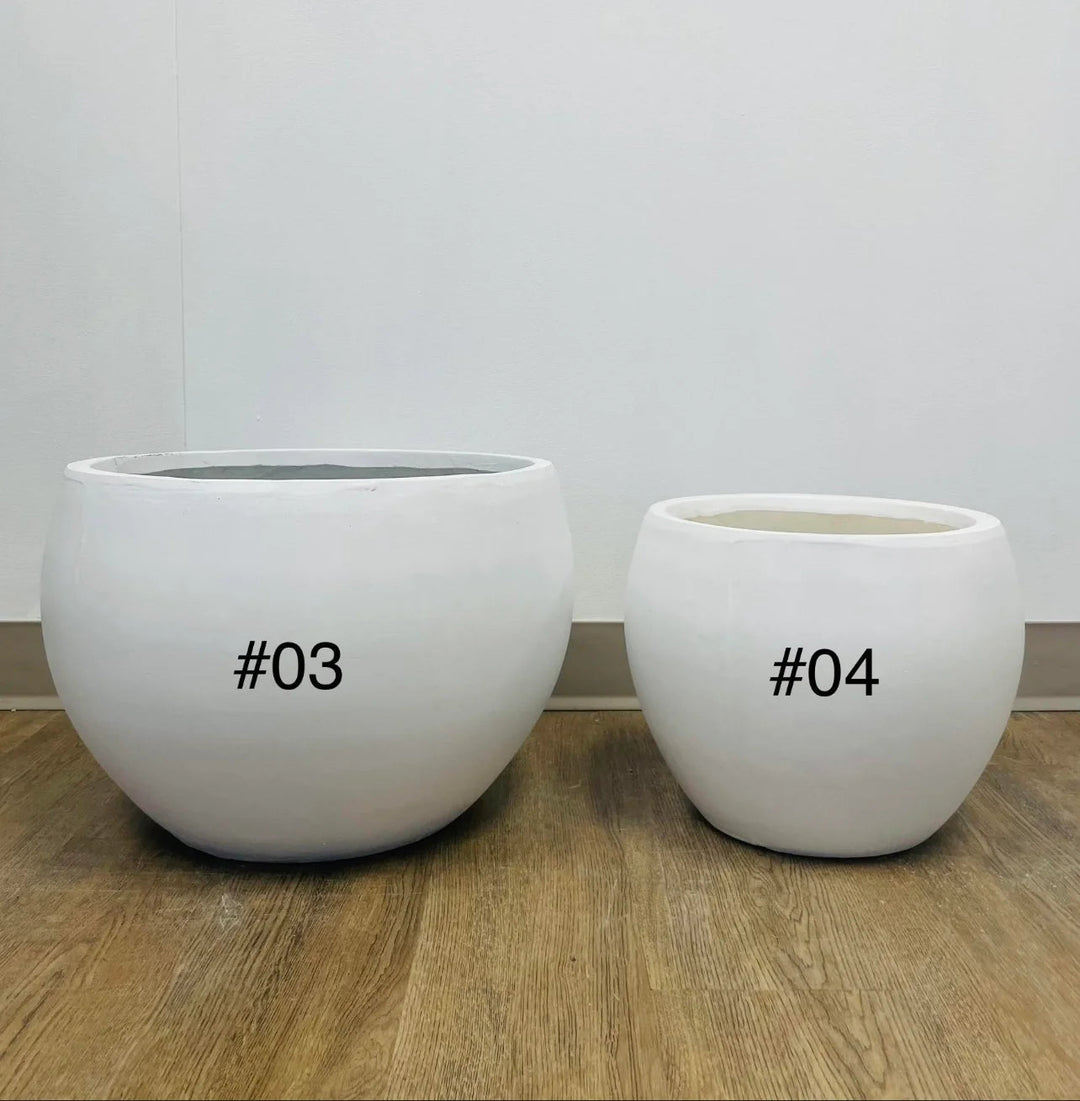 white cement round planters with a smooth finish, placed indoors on a carpeted floor near a window. What are the dimensions and weight of these planters?