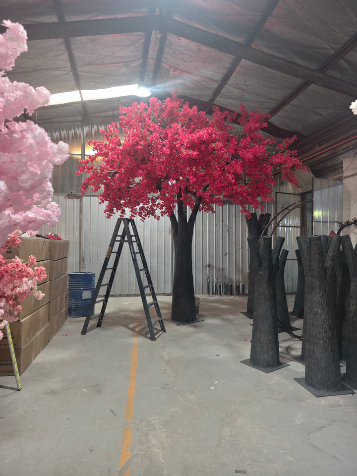 15ft Artificial bougainvillea tree with red flowers in a warehouse setting.