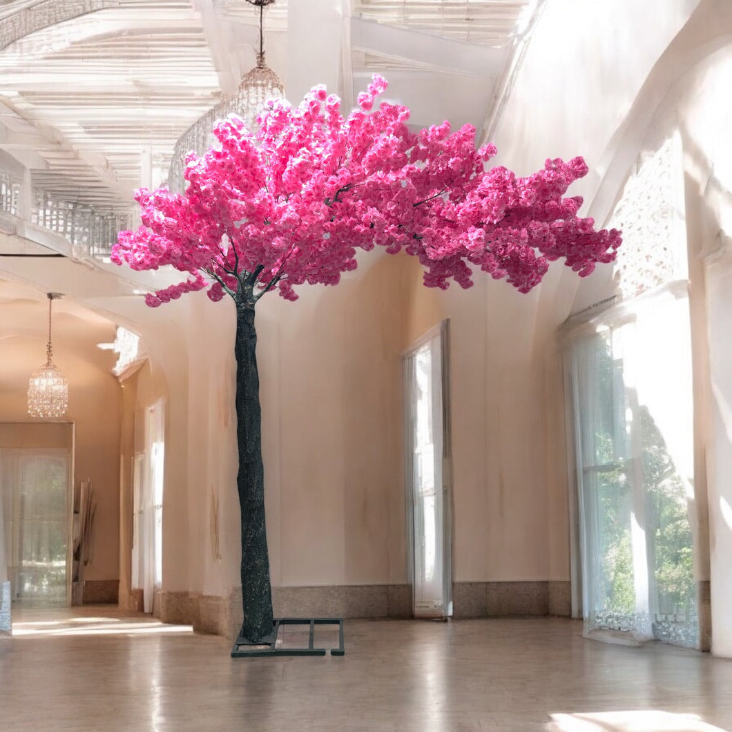 Elegant artificial cherry blossom tree with vibrant pink flowers set in a luxurious, sunlit wedding venue, adding a romantic flair to the decor. Can this artificial cherry blossom tree be customized for different event themes?