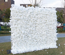 Charger l&#39;image dans la galerie, Large white artificial flower wall backdrop set up outdoors, perfect for events like weddings and photoshoots. 
Is this backdrop weather-resistant for outdoor use? What are the dimensions and how easy is it to assemble? Can the flower density or color be customized for specific themes?
