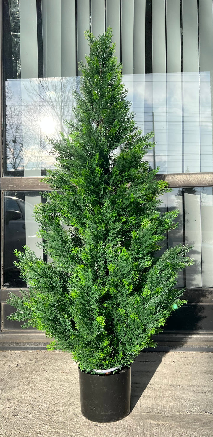 Artificial evergreen tree in a black pot with vibrant green foliage, placed outdoors, perfect for enhancing the exterior or entrance areas with a natural touch