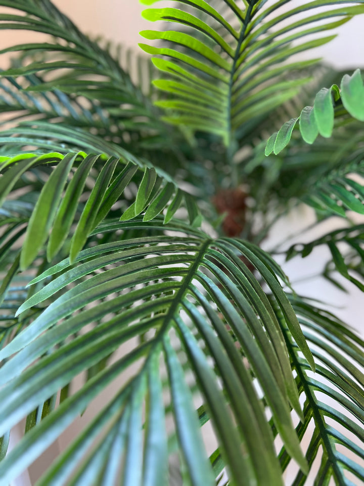 High-quality artificial palm tree leaves with intricate detailing, perfect for indoor décor.
