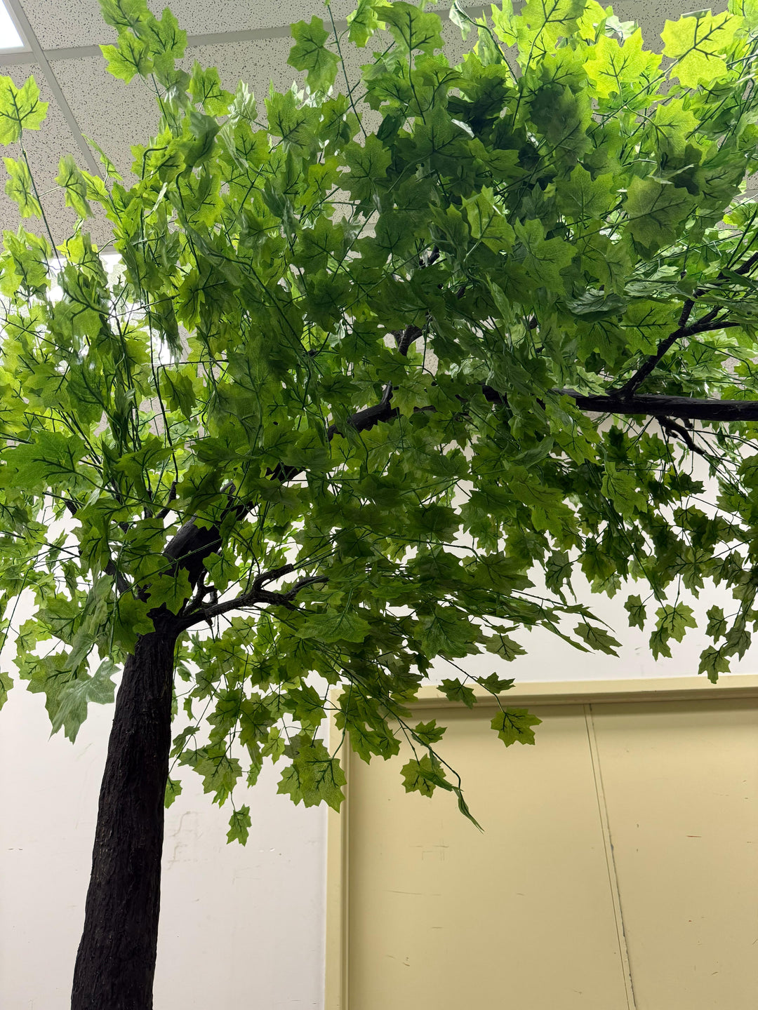 8ft arch artificial maple tree with curved trunk and wide canopy.