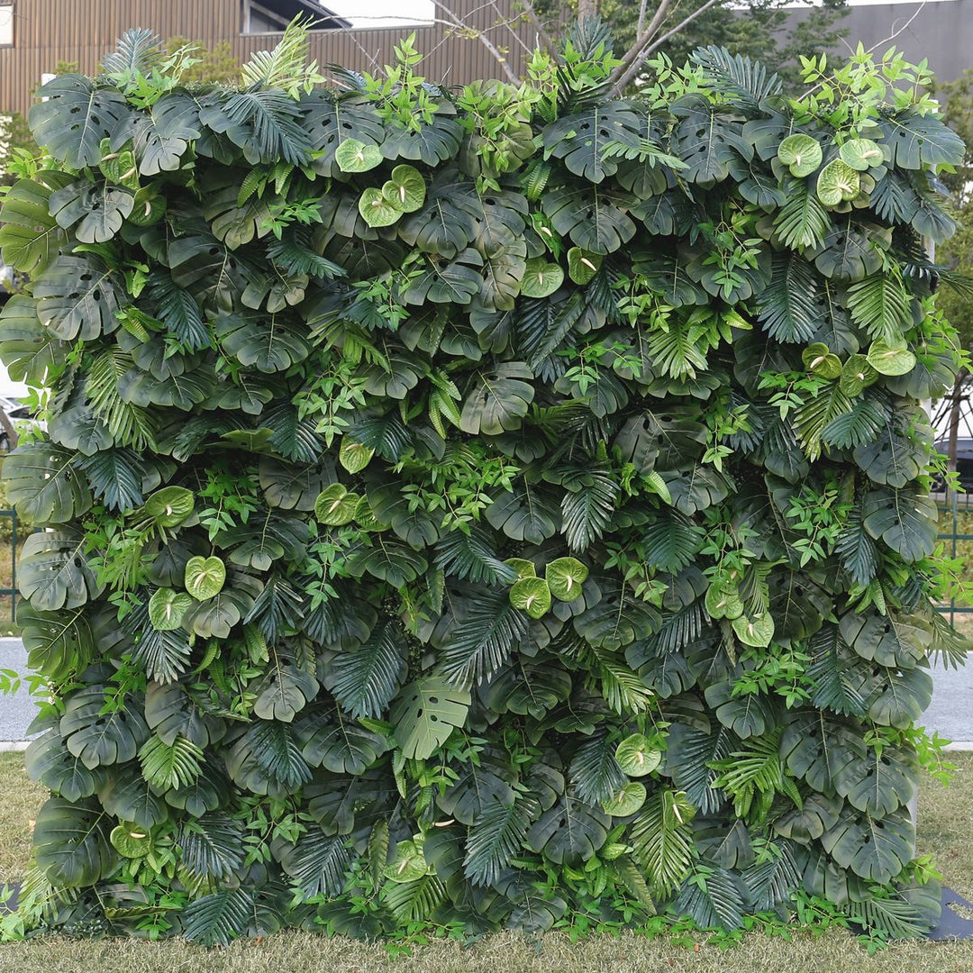 Artificial green backdrop with dense tropical leaves, perfect for wedding decor, photo shoots, and home decor. Is this green wall suitable for both indoor and outdoor settings? How does this artificial plant wall hold up in different weather conditions?