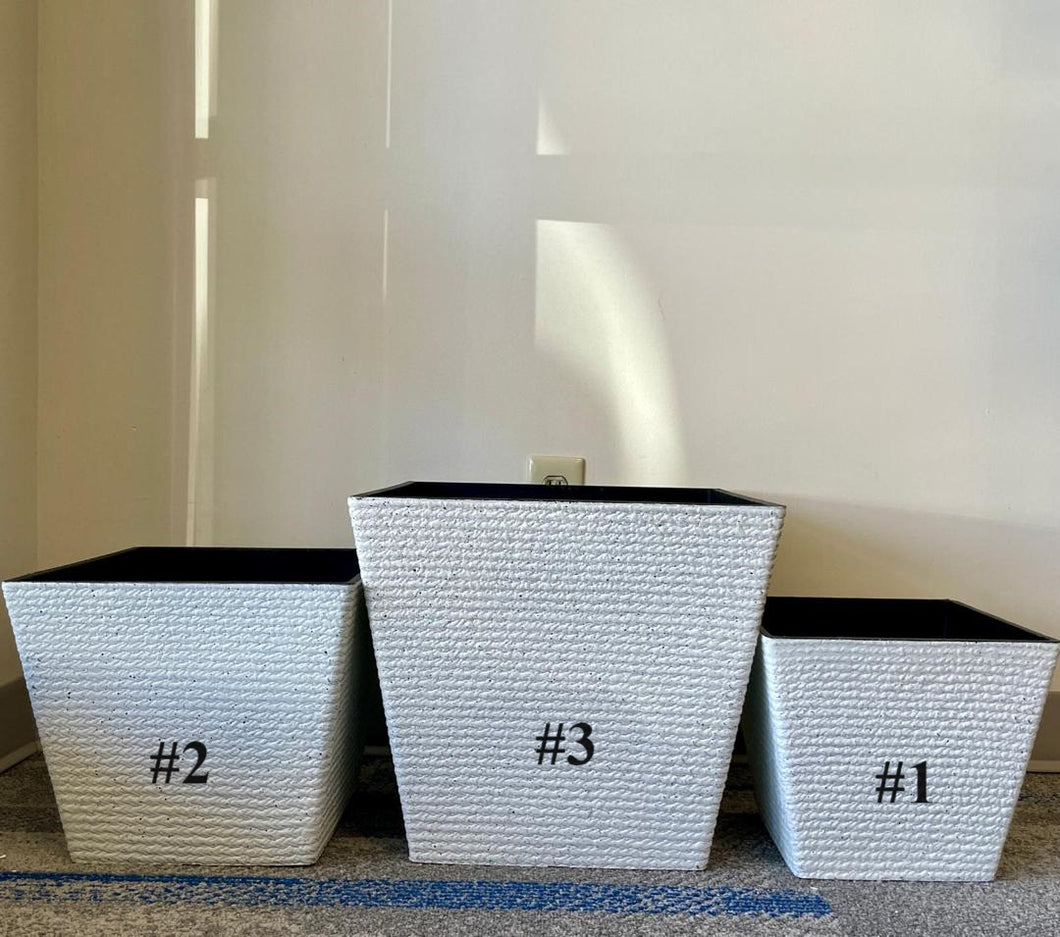 Three white textured square planters labeled #1, #2, and #3, arranged side by side. The planters vary in size, with #1 being the smallest, #2 medium-sized, and #3 the largest. The interior of each planter is black, providing a modern contrast to the white exterior.