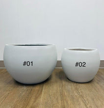 Load image into Gallery viewer, Two minimalist gray pots/planters of different sizes placed on a wooden floor. The larger planter is labeled #01, and the smaller planter is labeled #02. Ideal for indoor or outdoor use in modern and contemporary spaces.
