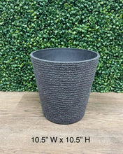 Charger l&#39;image dans la galerie, Gray textured planter measuring 10.5 inches wide by 10.5 inches high, displayed against a green leafy backdrop on a wooden floor.
