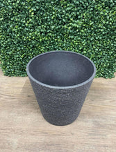 Load image into Gallery viewer, Gray textured planter measuring 10.5 inches wide by 10.5 inches high, displayed against a green leafy backdrop on a wooden floor
