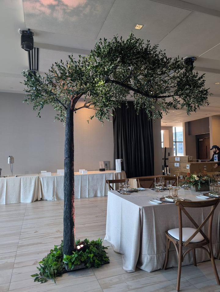 Decorative artificial arch olive tree adding ambiance to an event venue at Universal Event Space, WoodBridge.
