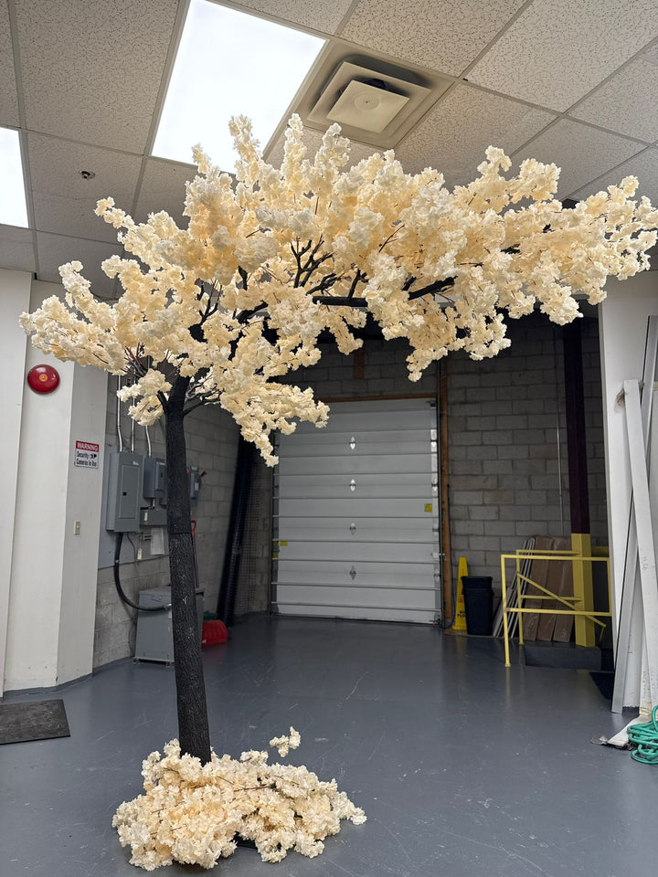 Off-white cherry blossom arch for weddings and event venues.