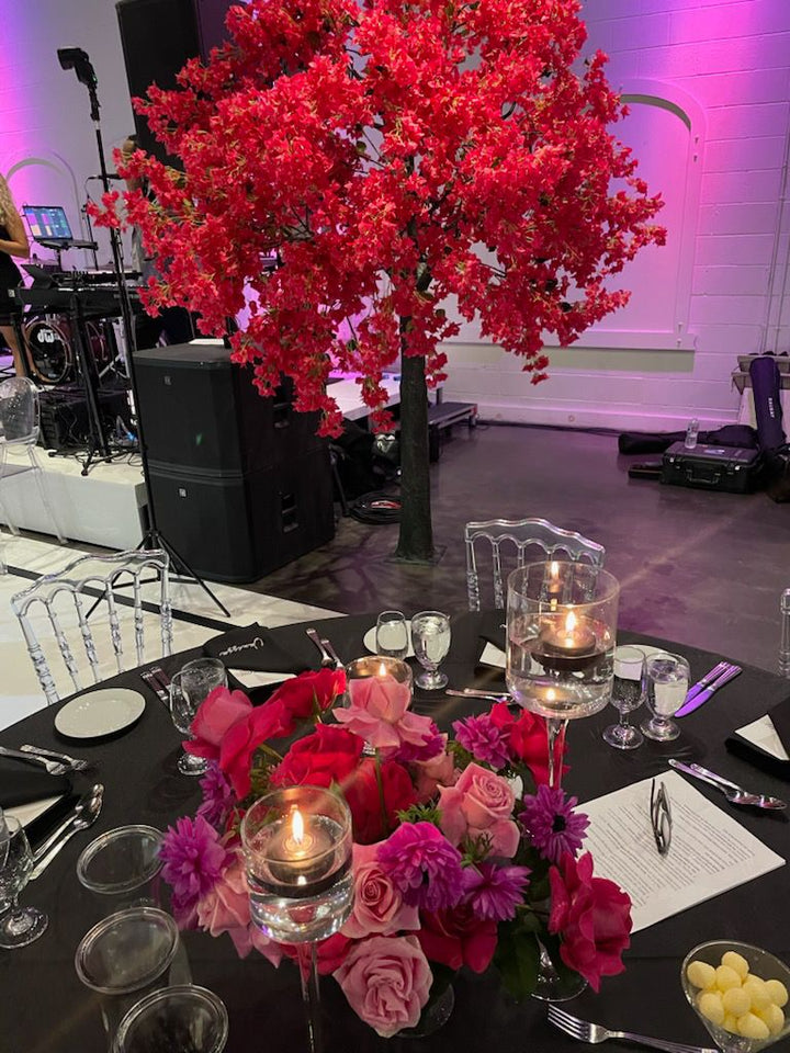 Bougainvillea tree standing beside a photo area inside a Toronto banquet space