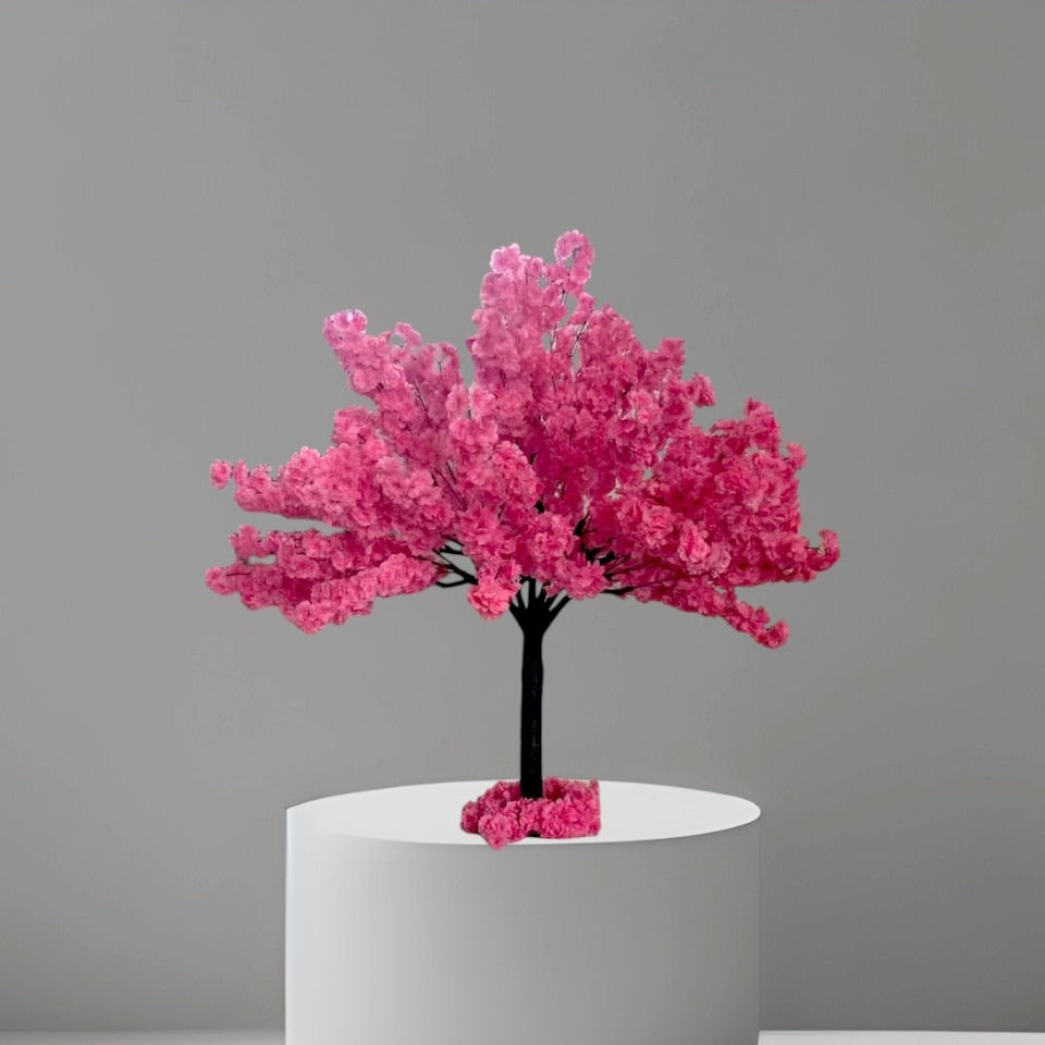 4ft artificial cherry blossom tree in dark pink color with dense silk flowers and black textured trunk, standing in a black nursery pot inside a modern living room
