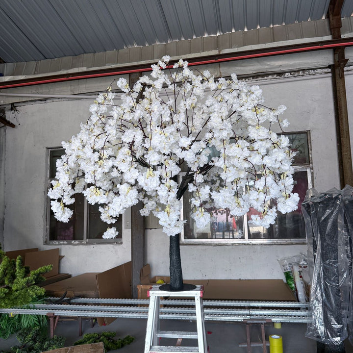 white weeping cherry blossom branches and lifelike foliage getting ready for an event in GTA, close-up