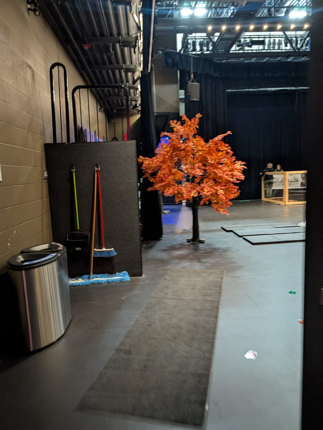 Realistic autumn maple tree prop with red and golden foliage set at Five Points Theater, Barrie.