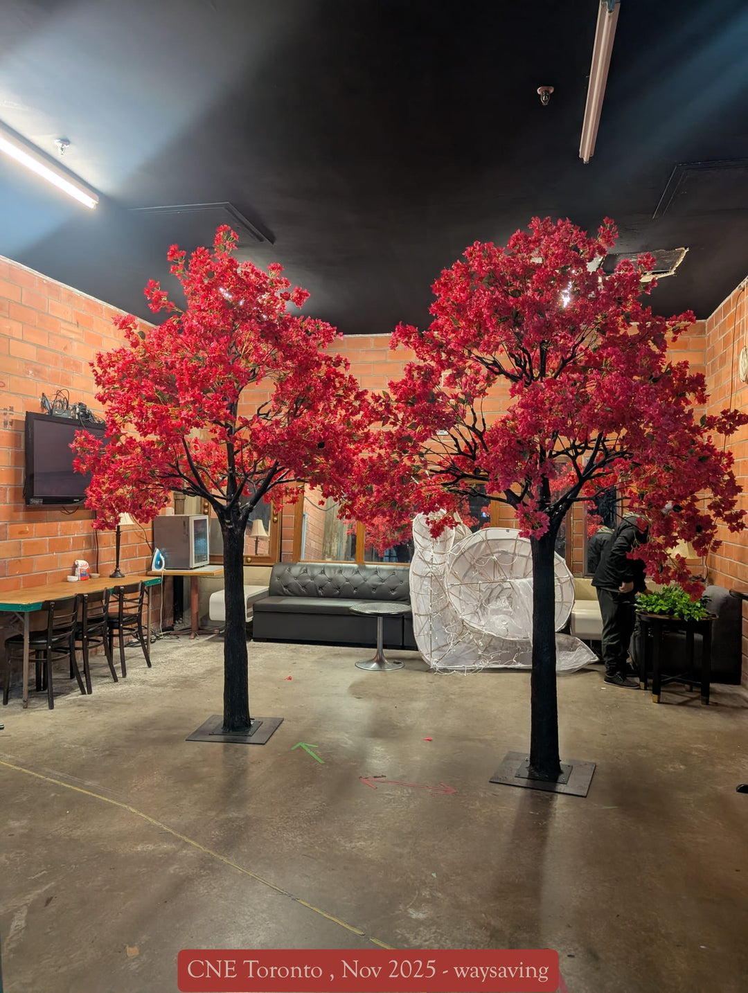 Close-up of hot pink bougainvillea flowers on a tall artificial trees used for event décor