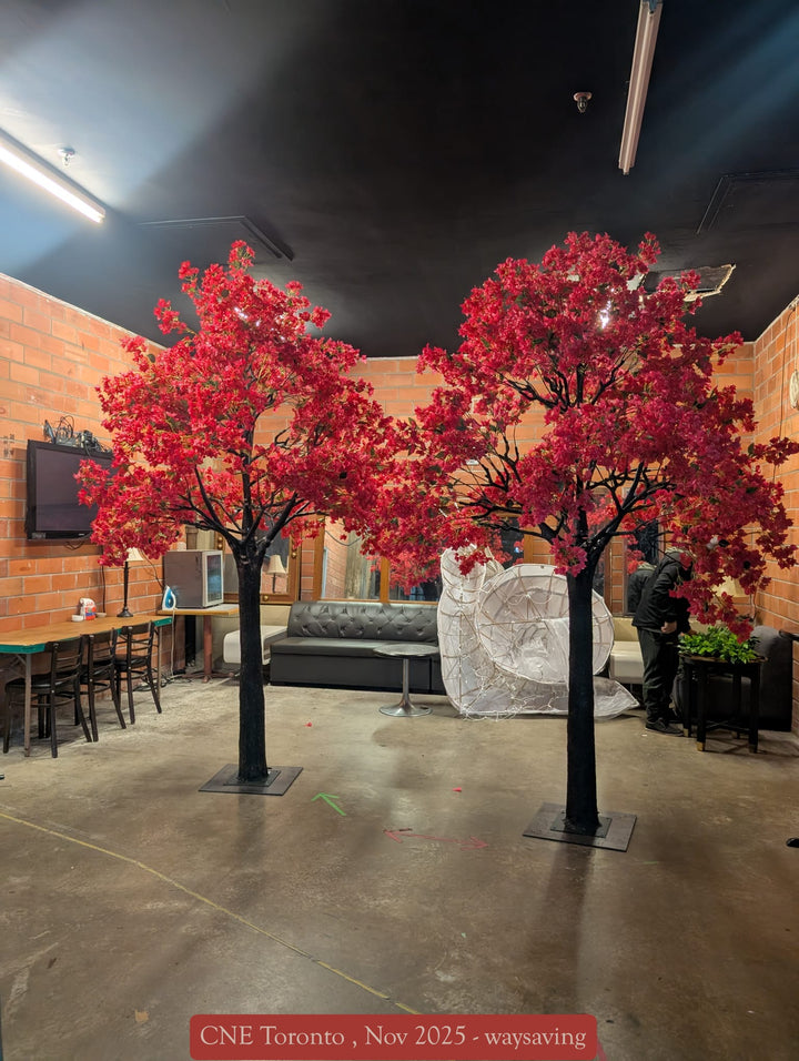 Close-up of hot pink bougainvillea flowers on a tall artificial trees used for event décor