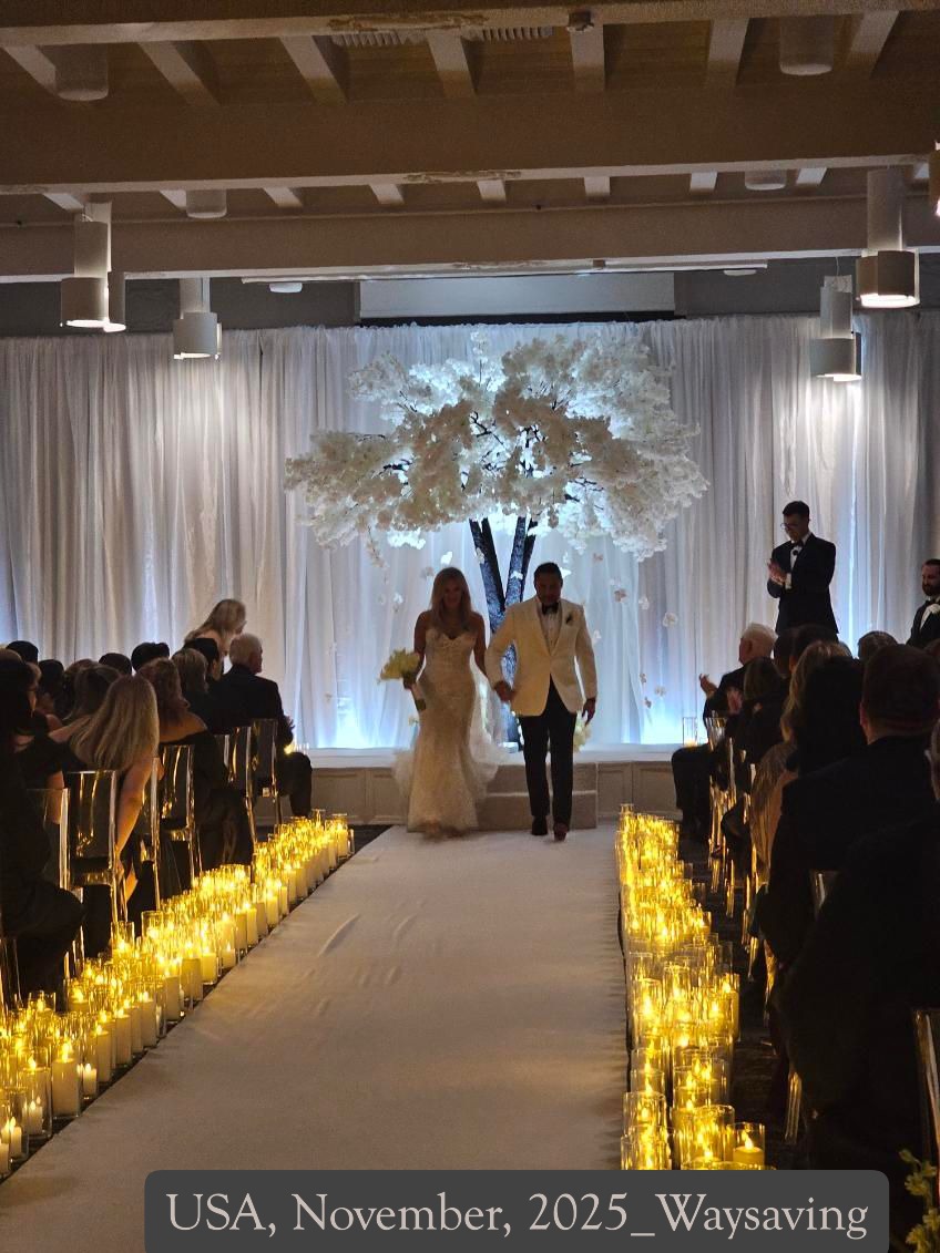 Tall faux white cherry blossom tree with white flowers for wedding backdrops used at a wedding in USA.