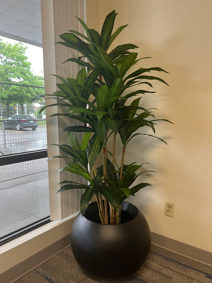 Full-height artificial yucca plant showing upright architectural form and narrow footprint.