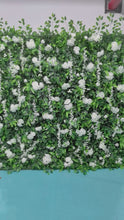 Charger et lire la vidéo dans la visionneuse de la Galerie, Artificial floral wall featuring white roses and orchids with lush greenery, ideal for wedding backdrops, photo booths, and event decor. What are the dimensions of this flower wall? Is it weather-resistant for outdoor use? How realistic do the flowers look in photos and up close?
