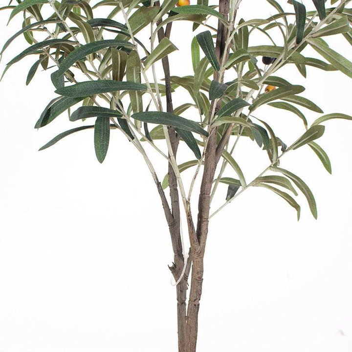 artificial plants. Close-up of the detailed trunk and branches of an artificial olive tree with a textured, lifelike appearance. A green tag with the brand name "Waysaving" is attached to one of the branches. The tree features realistic bark textures and connected branches, making it a convincing decorative piece for indoor settings.