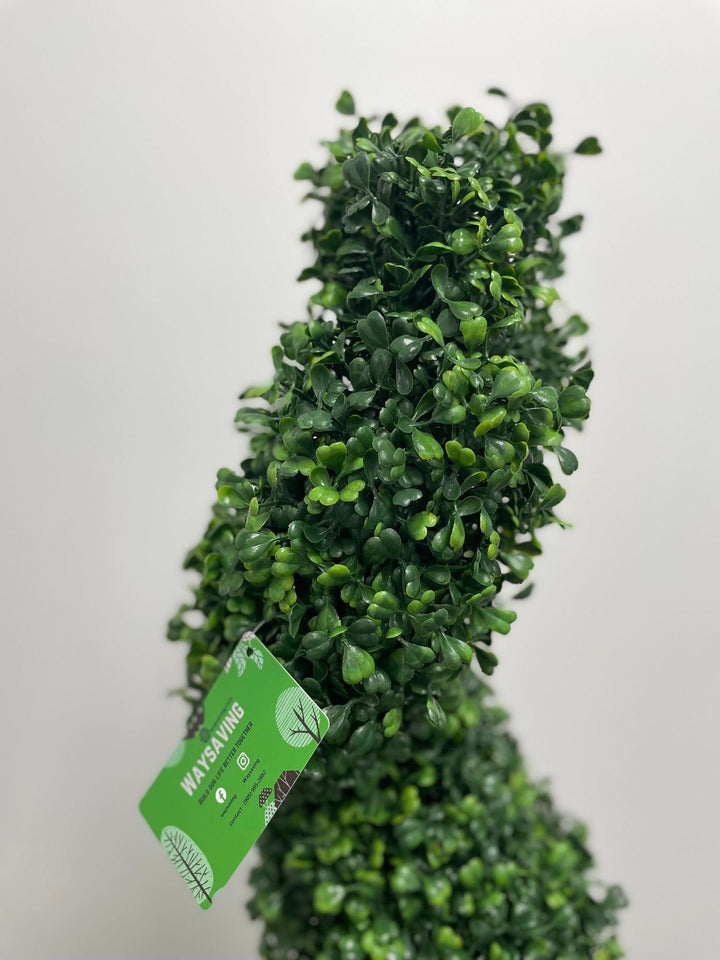 Close-up of lush, vibrant green artificial boxwood foliage, perfect for indoor or outdoor decoration.