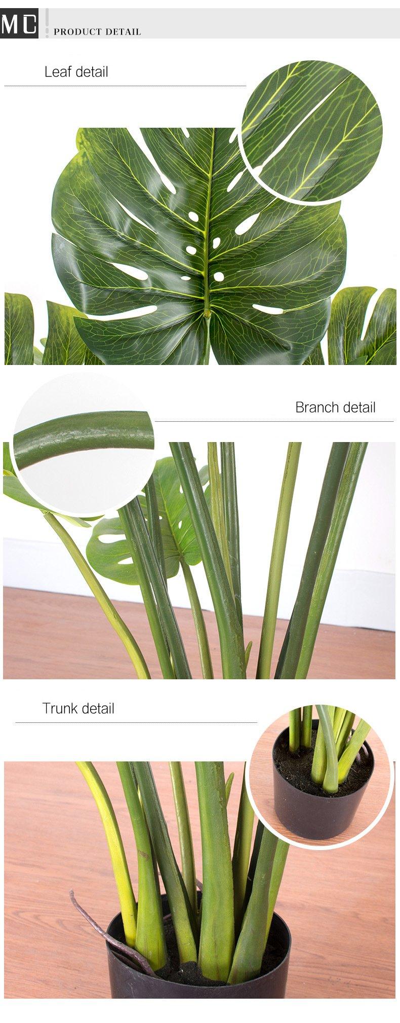 Detailed view of an artificial monstera plant, showcasing its realistic leaf, branch, and trunk textures. The image highlights the intricate design and lifelike appearance of the plant's leaves with prominent veins, sturdy branches, and a well-crafted trunk in a black pot