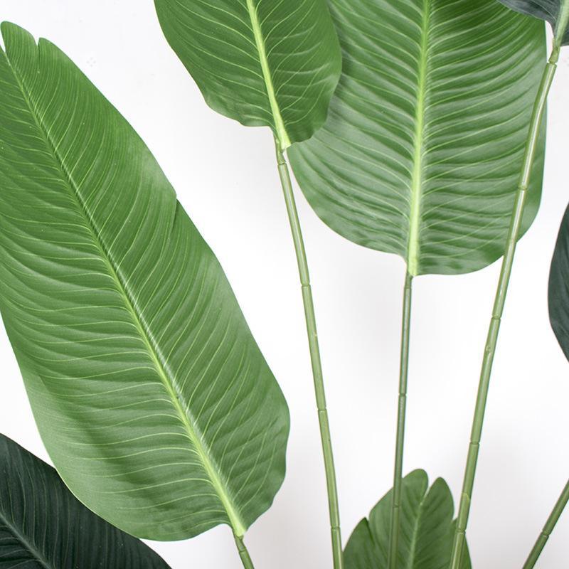 Close-up of silk blend leaves on artificial Bird of Paradise showing realistic textures.