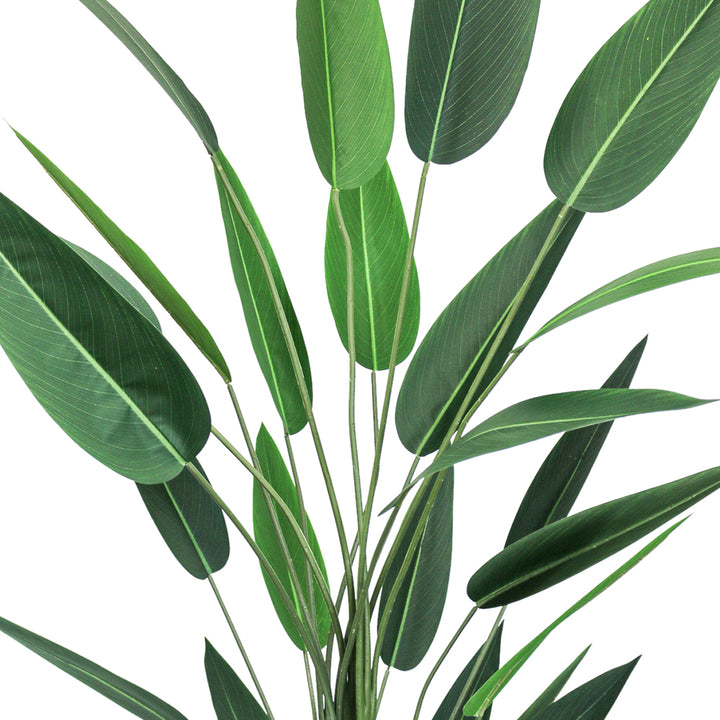 Close-up view of a large 7ft artificial bird of paradise plant, featuring multiple elongated green leaves with detailed veining, arranged in a natural, upward pattern against a white background.