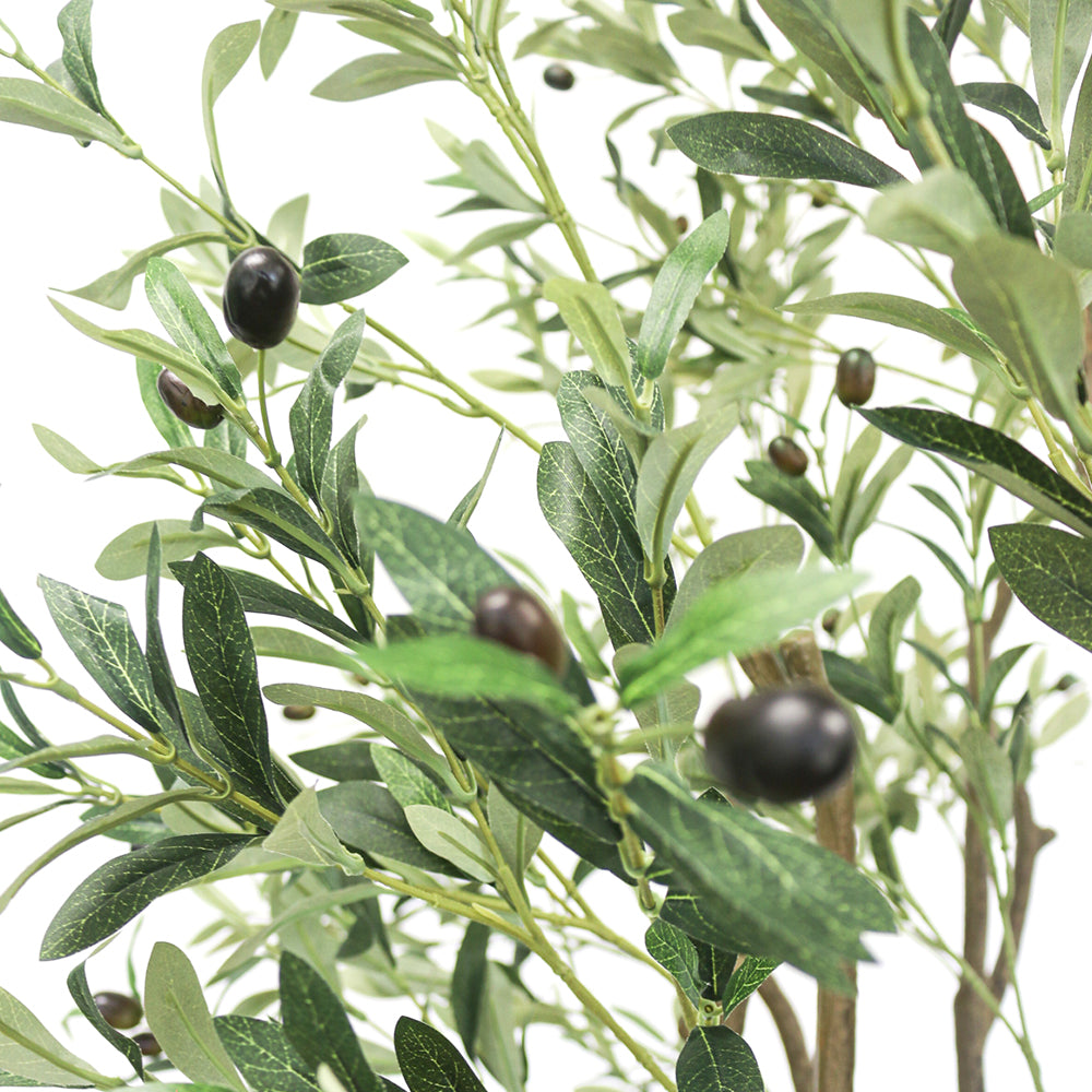 olive trees for decor. Close-up view of the artificial olive tree's leaves and small dark olives, showing the detailed texture and realistic design of the foliage against a neutral background