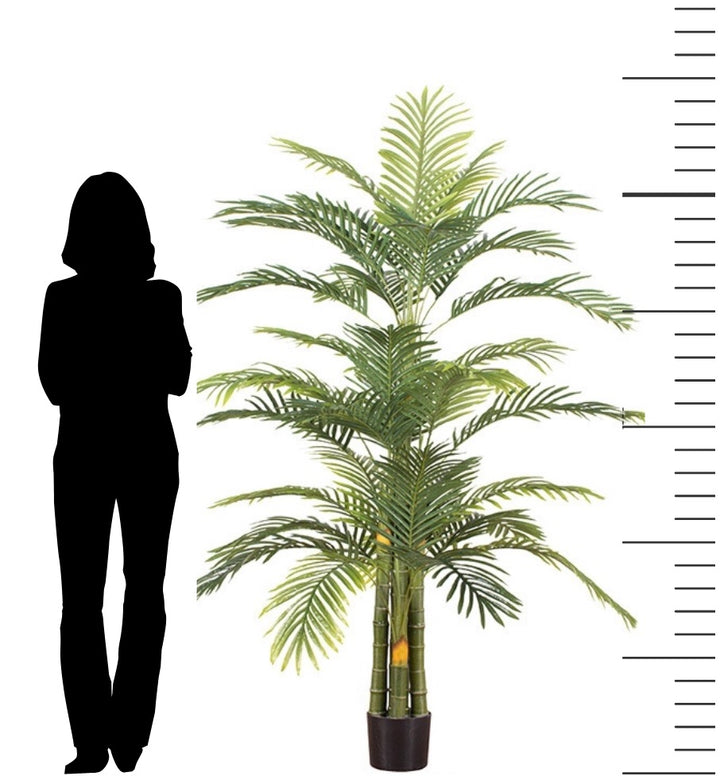 Large artificial palm tree plant with lush green feathery fronds, providing a tropical and natural look for indoor decor and creating a sense of scale against the silhouette of a person shown for size reference.