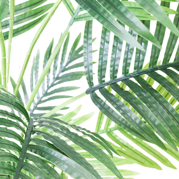 costco. Close-up of vibrant green artificial palm leaves, showcasing their detailed texture and lush tropical aesthetic, perfect for enhancing indoor decor with a natural touch.