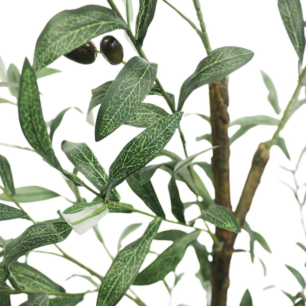 Close-up view of the artificial olive tree's leaves and small dark olives, showing the detailed texture and realistic design of the foliage against a neutral background.