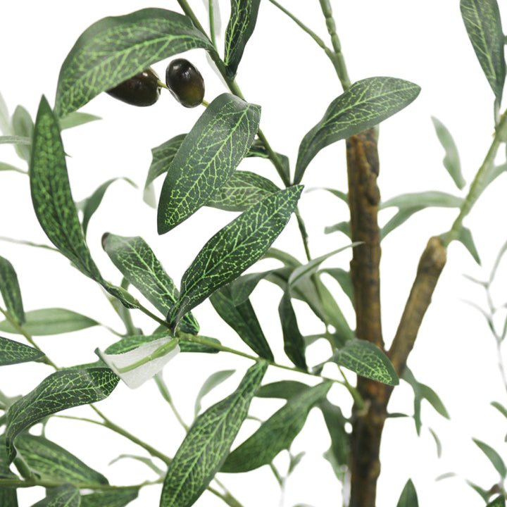 Close-up view of the artificial olive tree's leaves and small dark olives, showing the detailed texture and realistic design of the foliage against a neutral background.